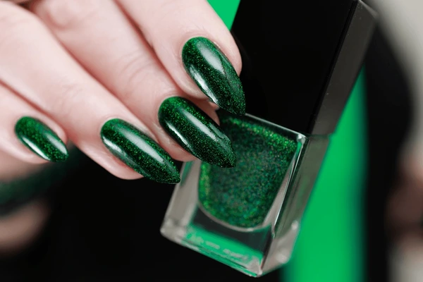 emerald green almond-shaped nails with forest green accents, elegant manicure