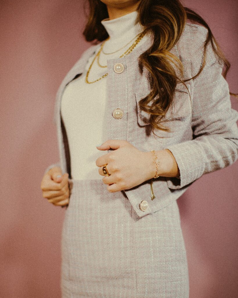 oversized houndstooth blazer with brown trousers, tailored office style