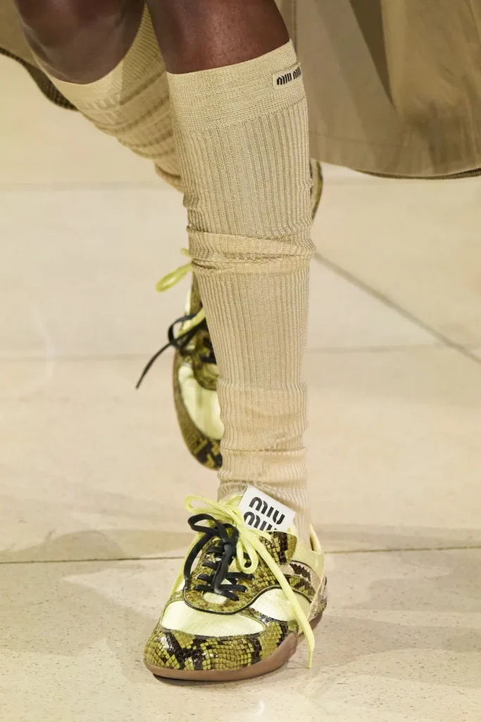 Bold red retro sneakers worn by celebrities, standout sneaker color trend for fall 2025