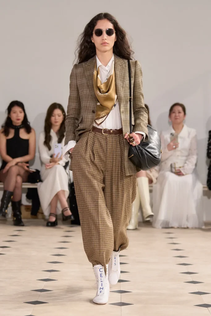 Classic white canvas sneakers styled for fall 2025, minimal lace-up shoe trend.