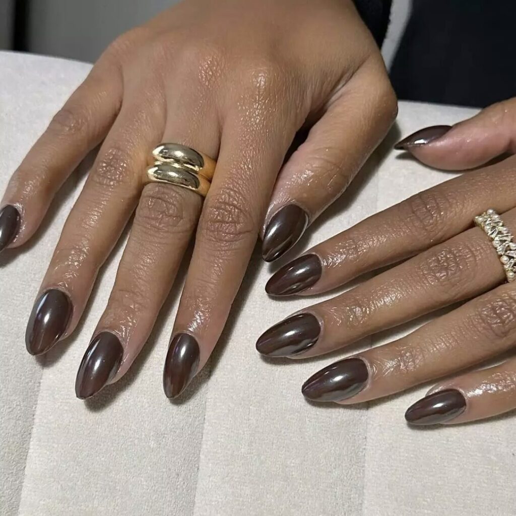 Ultra-glossy espresso nails with a mirror-like shine, reminiscent of freshly brewed coffee.