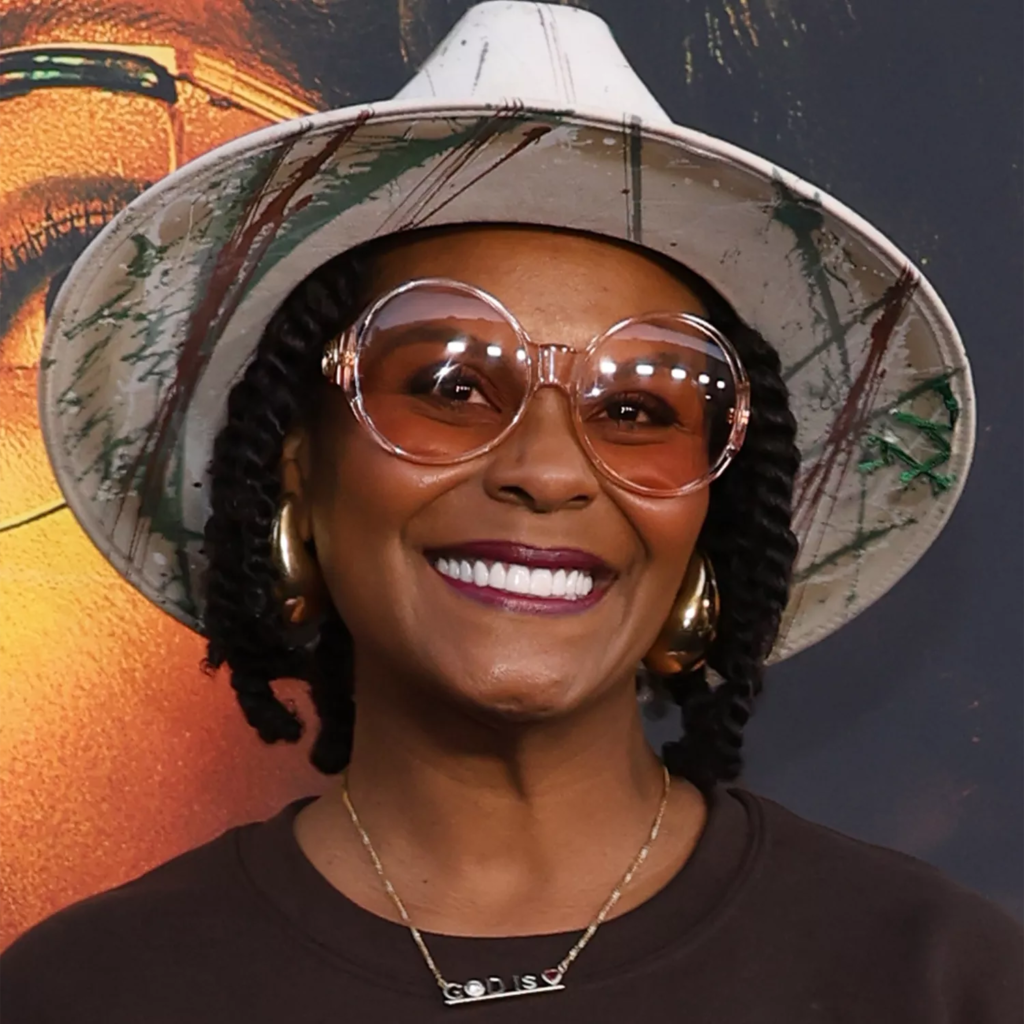 Tabitha Brown with chunky protective twists styled with natural texture and hair accessories