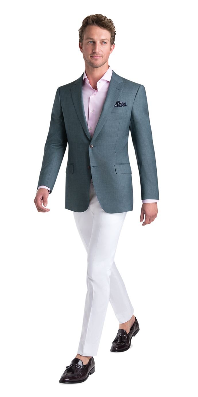 man wearing teal blazer and grey tie with brown brogues