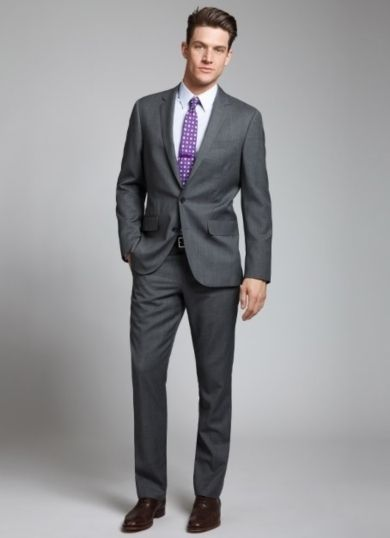 man wearing gunmetal blazer with charcoal shirt and leather loafers