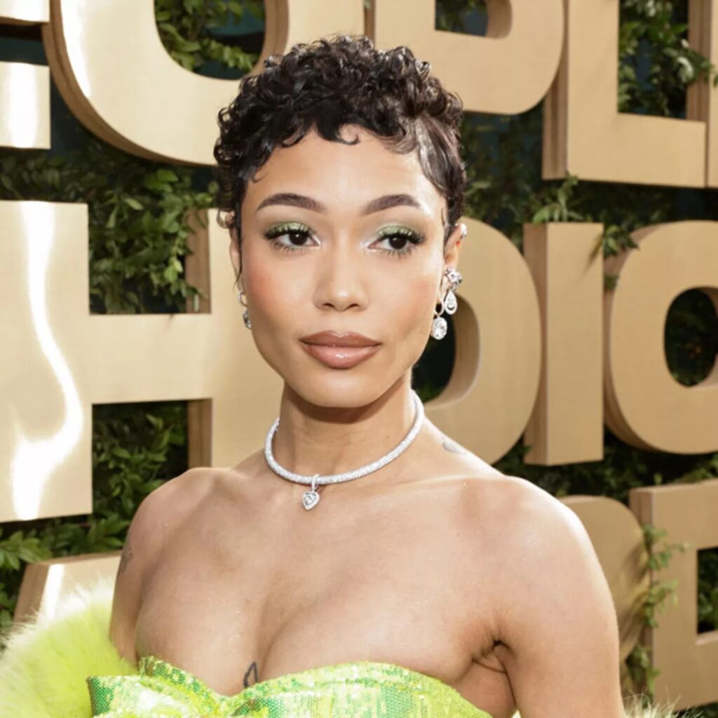 Coi Leray wearing sculpted side part short curls with finger waves and baby hair edges