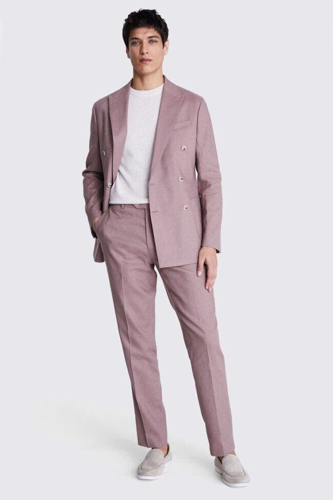 man in mauve suit with grey shirt and oxblood brogues