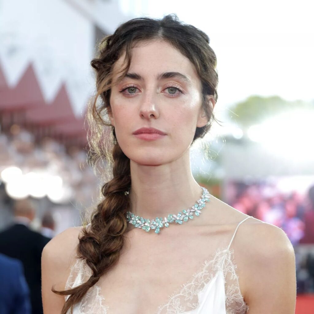Voluminous puffy braid pulled apart for a soft, airy texture.
