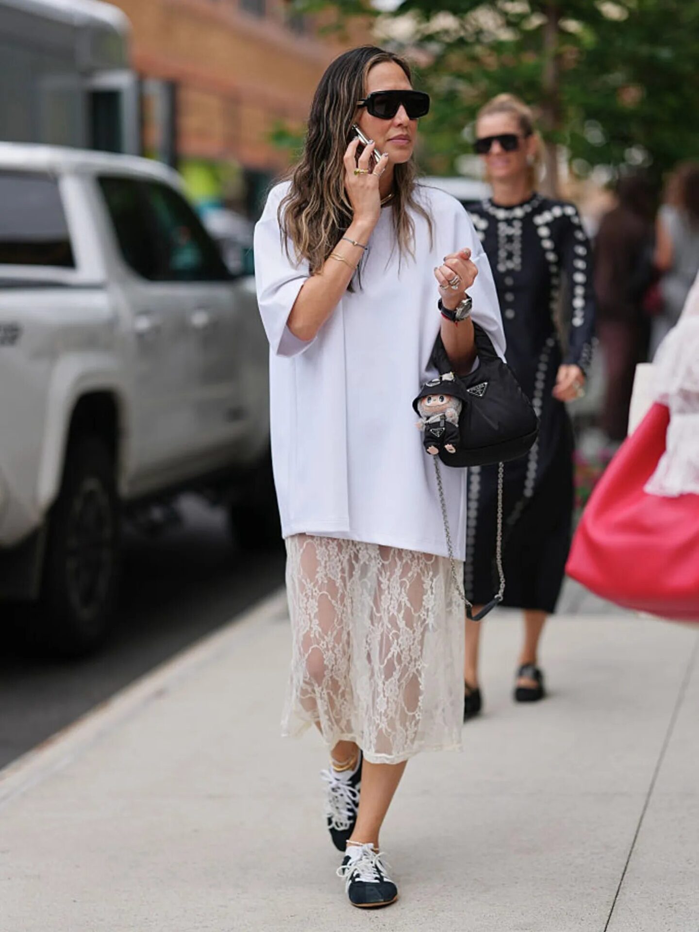 Bohemian-inspired fall look featuring a maxi skirt, oversized tee, and sneakers.