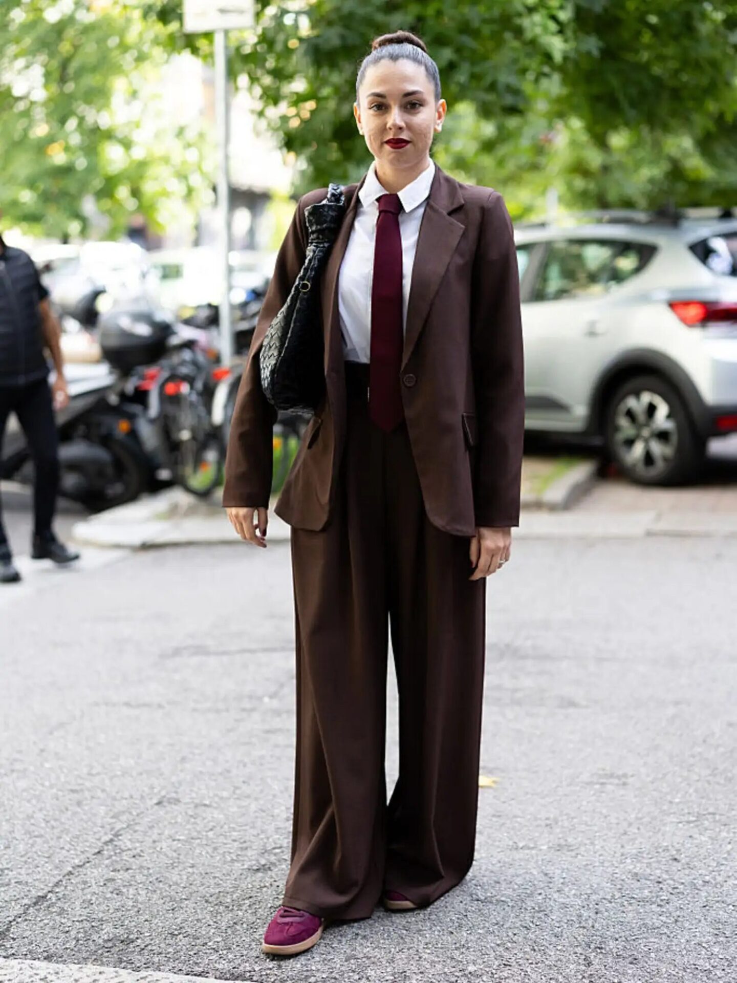 Power suit and sneakers styled for modern workwear with effortless polish.