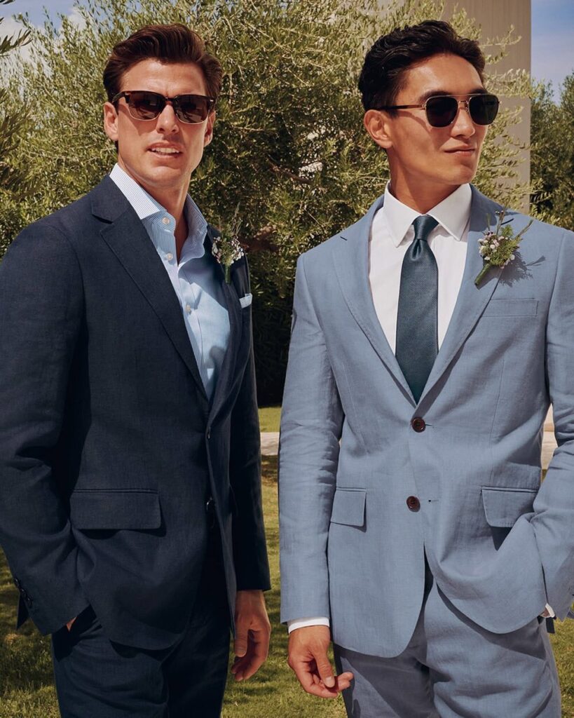 Man wearing Charles Tyrwhitt Italian wool suit in navy with classic white shirt and tie, showcasing refined British tailoring.