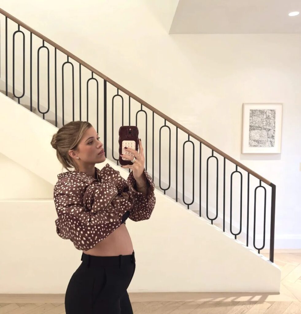 Runway model in Burberry fawn-print outfit showing the revival of deer print in modern fashion.