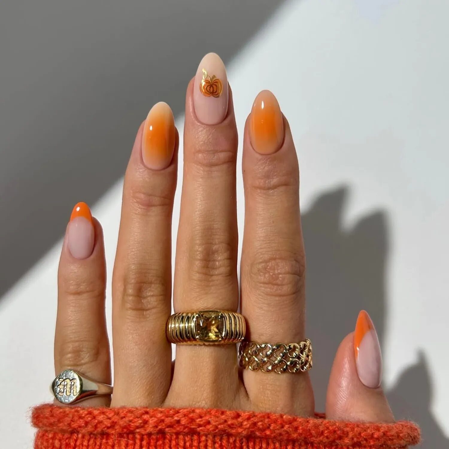 Gradient orange aura nails with minimal French tip accents