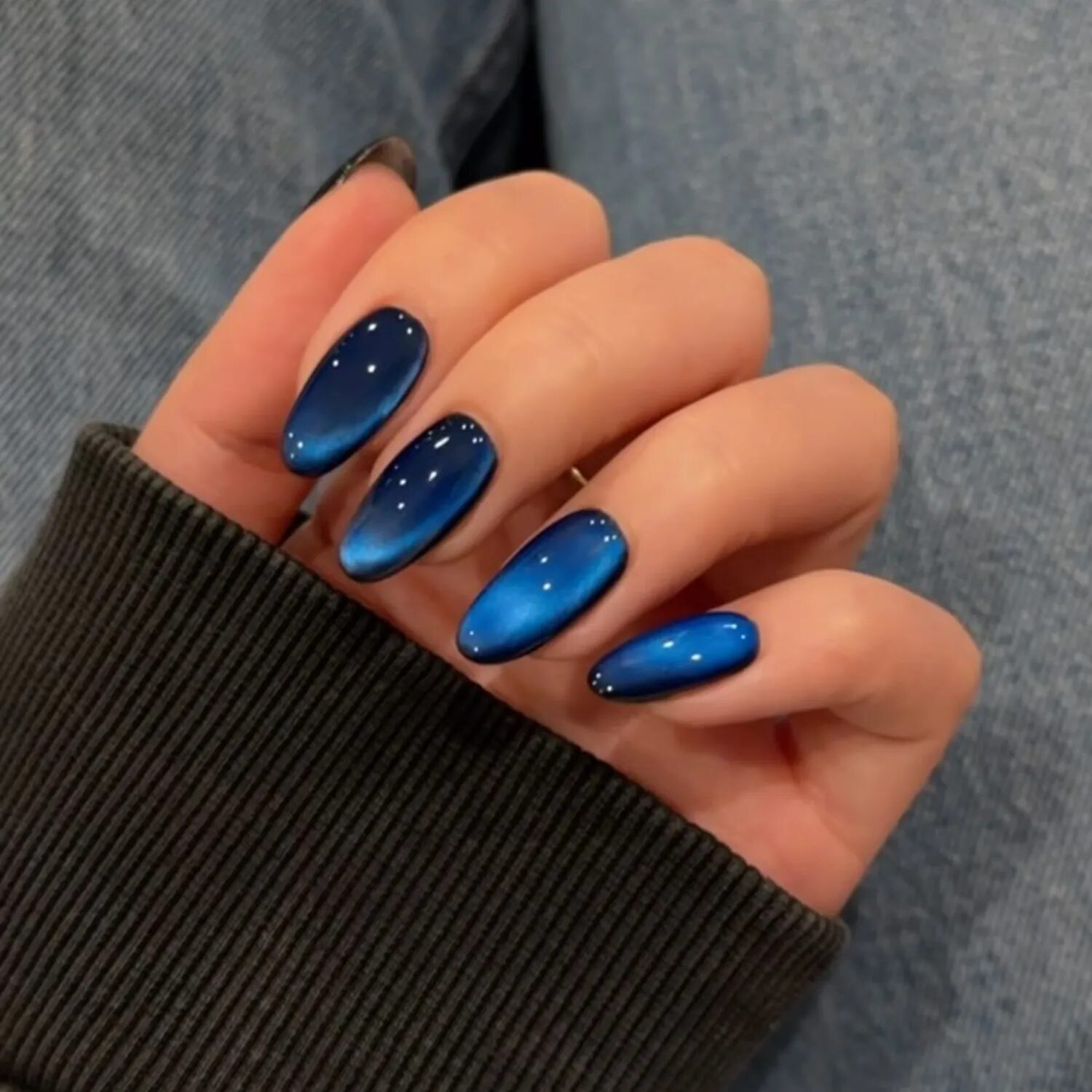 Glossy navy blue velvet glass nails with high-shine finish, trending elegant manicure 2025.