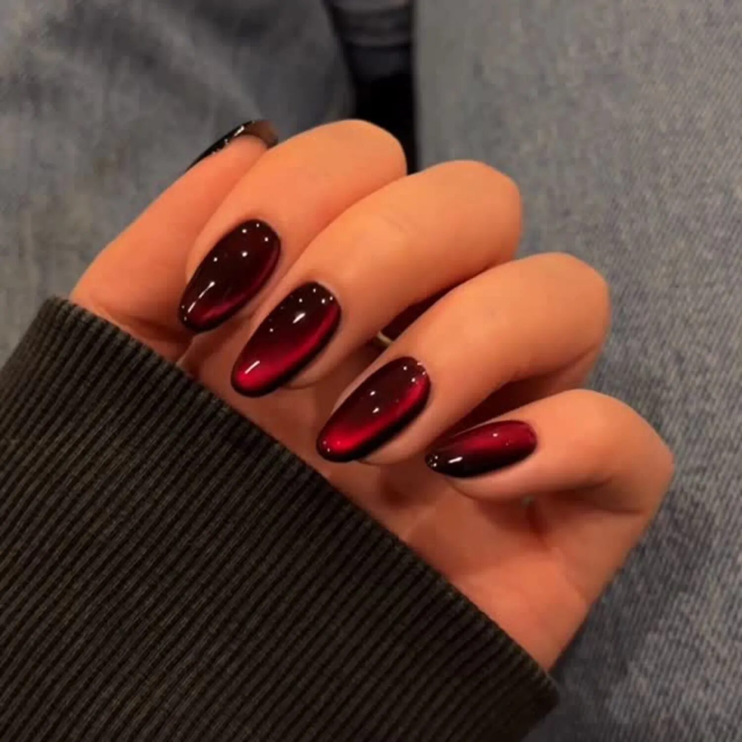 Deep red velvet glass manicure with luxurious, moody vampy finish perfect for Halloween season.