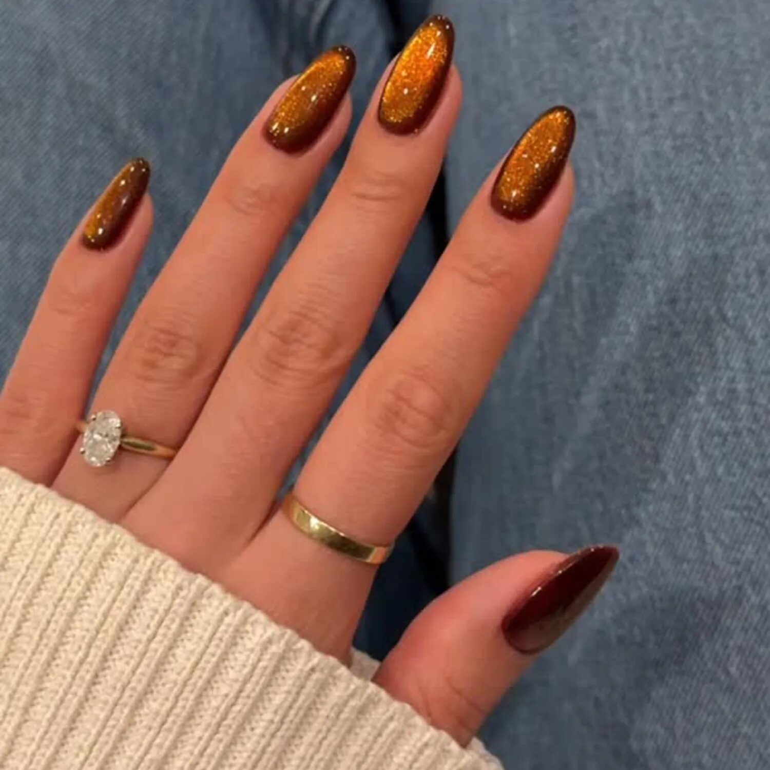 Amber and ember velvet glass nails with mustard tones and dark black base, fall nail trend.