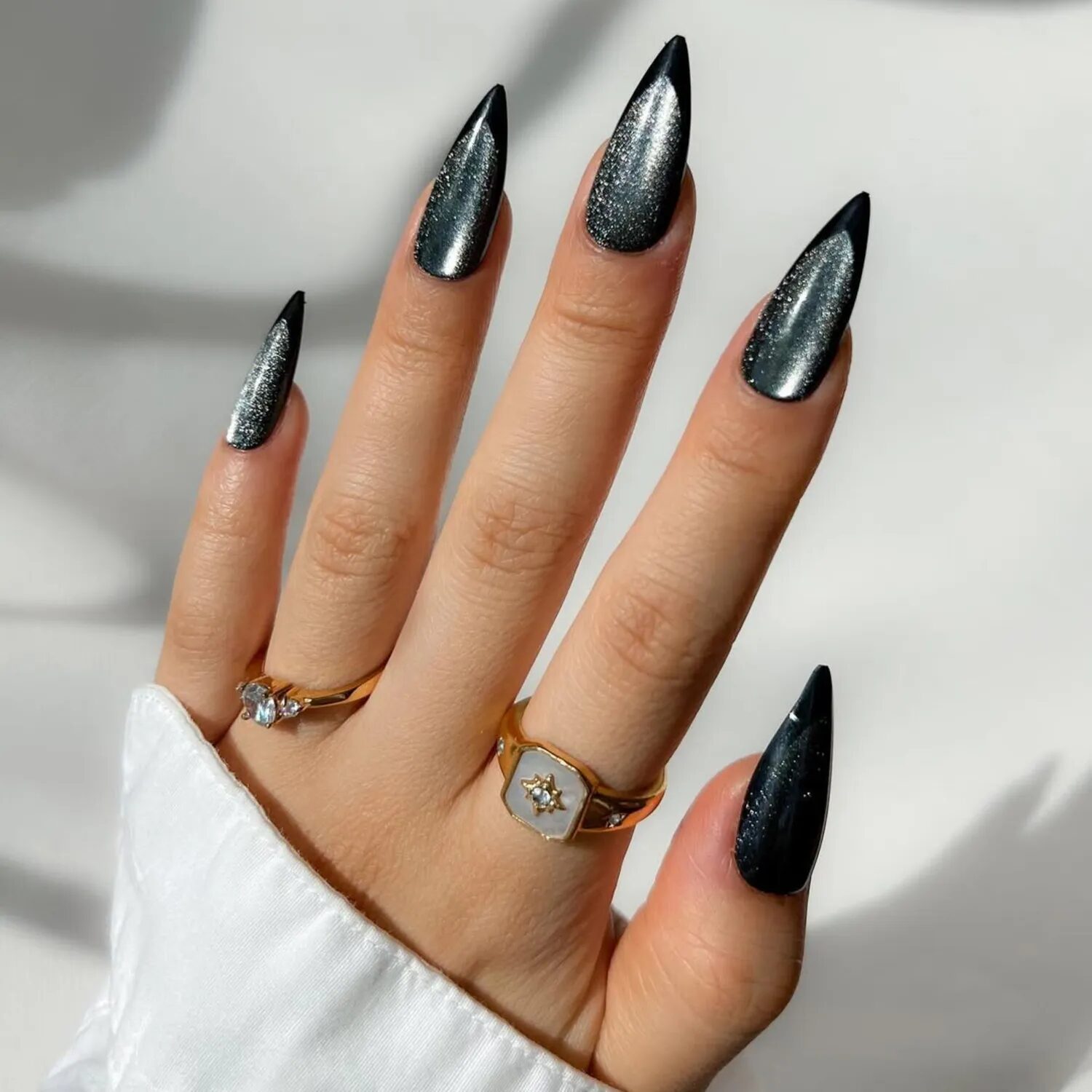 Black velvet French manicure with moody shimmer finish, edgy Halloween nail idea.
