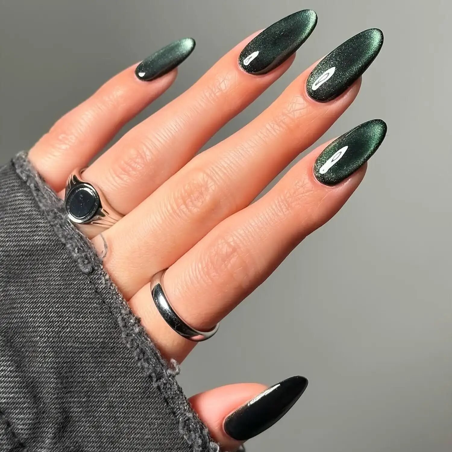 Dark sage evergreen velvet glass nails with deep shimmering finish for winter 2025.