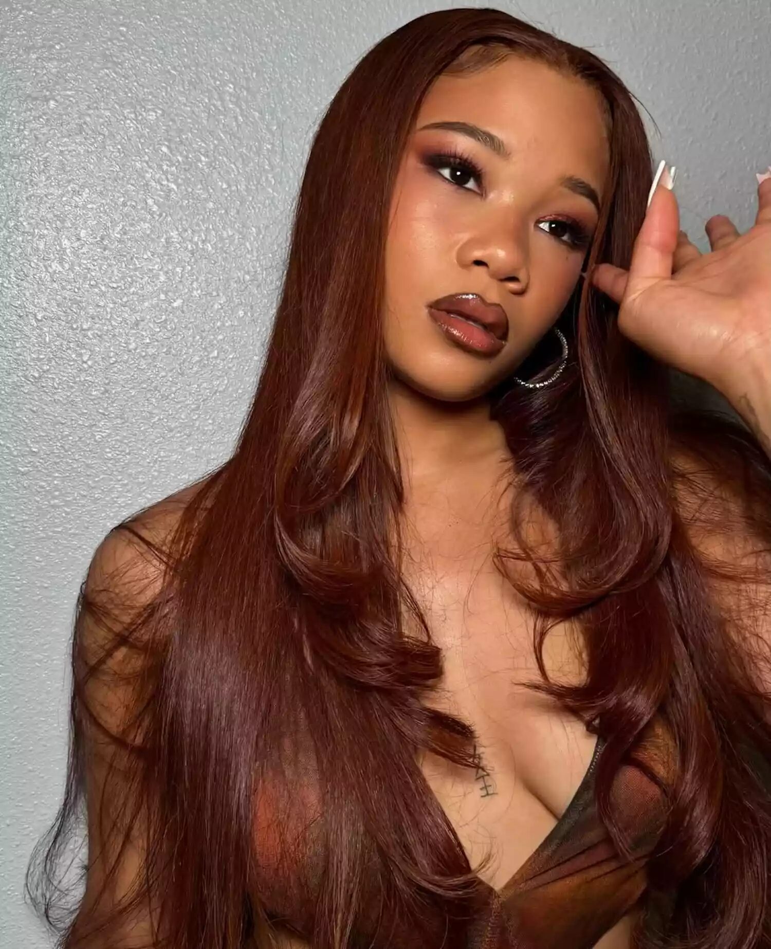 Vibrant light red and copper highlights reflecting sunlight for a bright, healthy summer hair refresh.