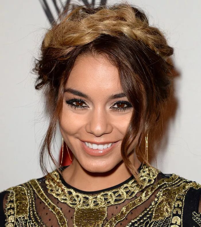 Elegant crown braid wrapped around the head with face-framing pieces.