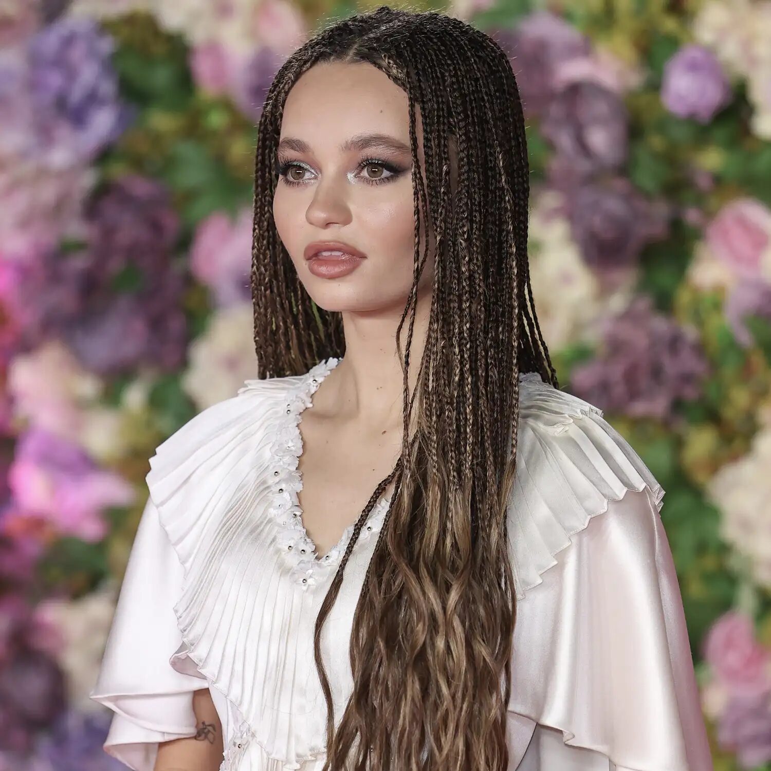 Braided hairstyle in chestnut brown tones, featuring rich, natural color and subtle shine.