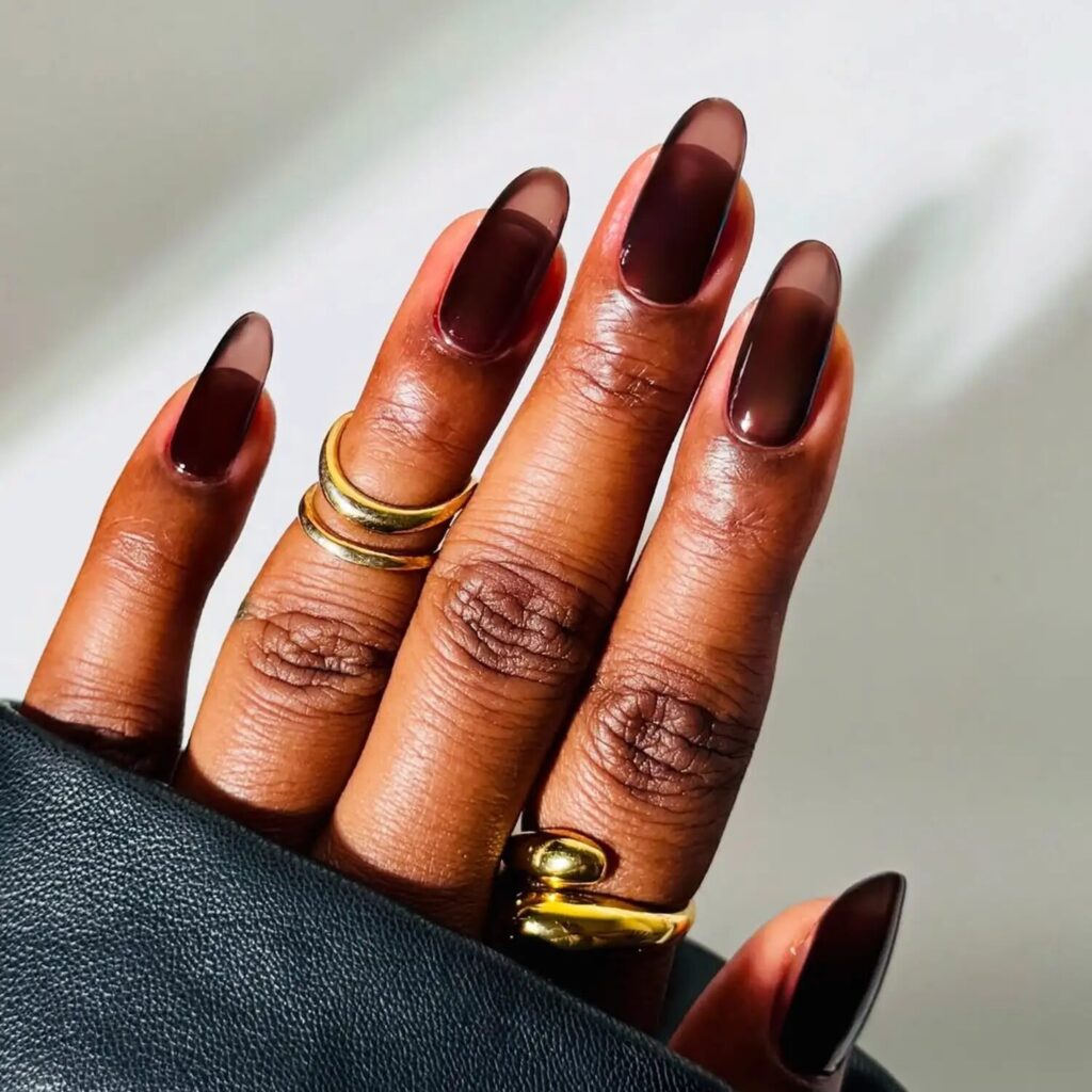 Elegant sheer espresso brown nails with subtle shine and minimalist Scorpio-style polish