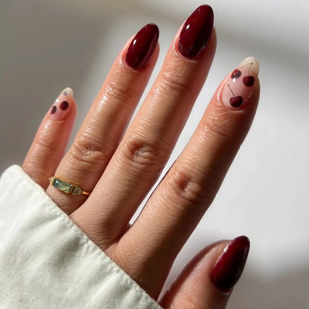 Glossy deep cherry red nails with rich, romantic color perfect for Scorpio season