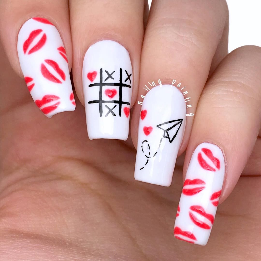 Nails with graphic elements and doodle-style hearts