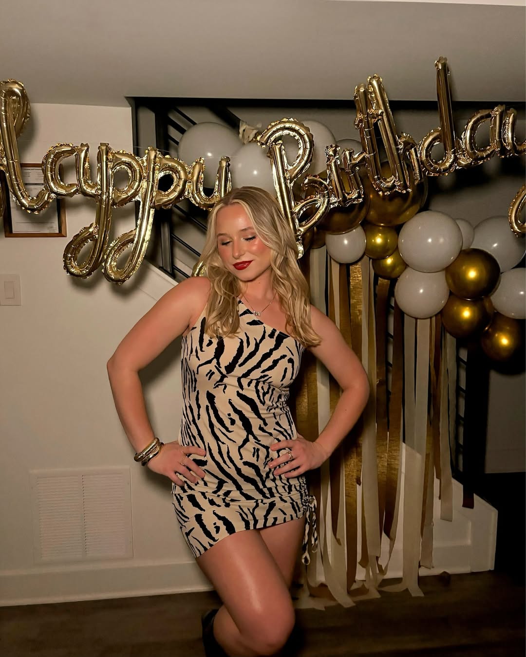 A one-shoulder zebra print dress.