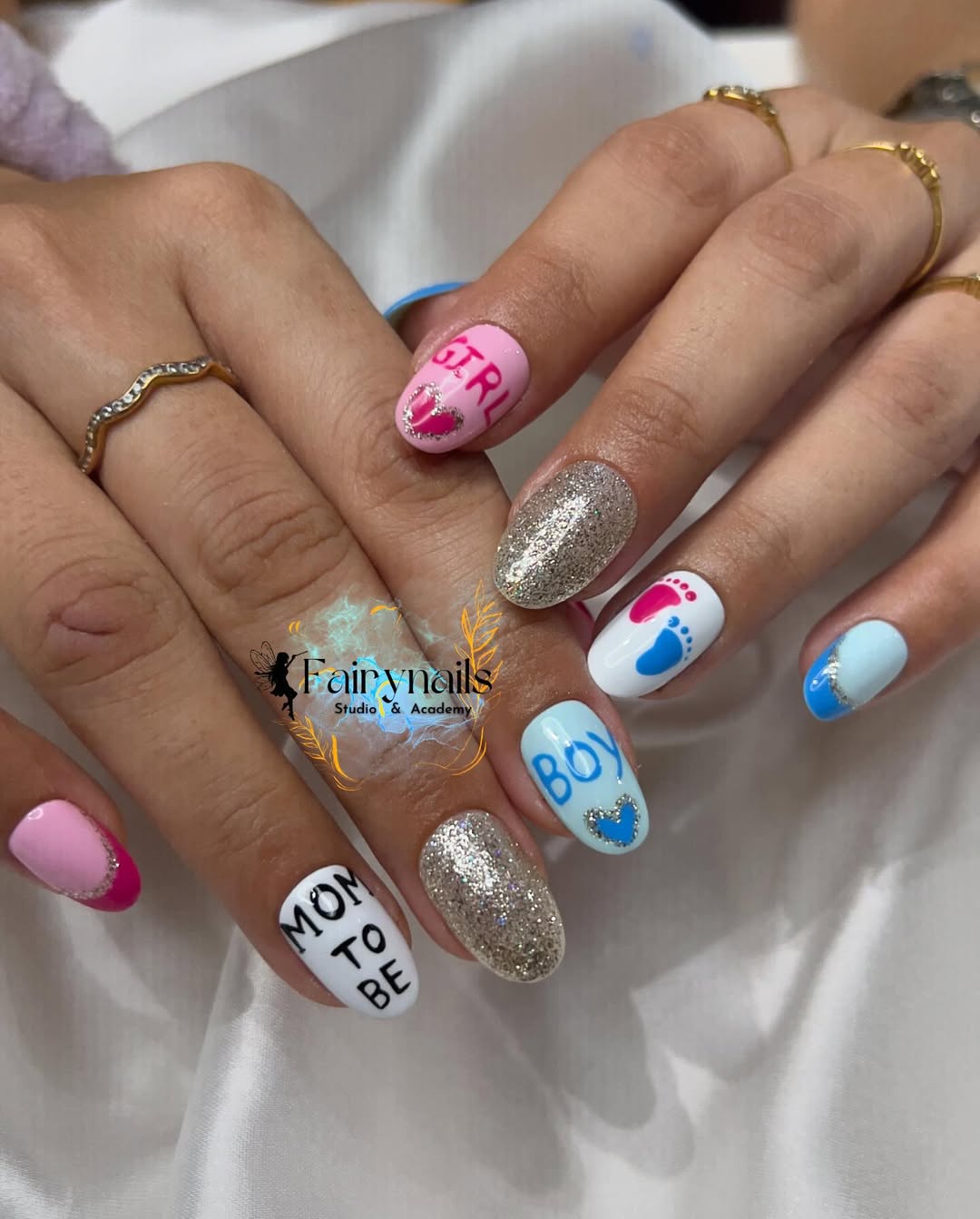 Glitter, footprints, and 'MOM TO BE' text in pink and blue