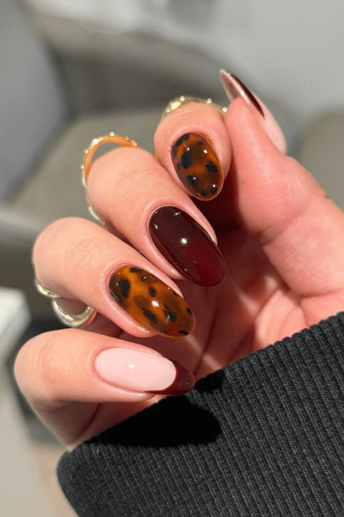 Deep red wine nails with tortoise shell accents
