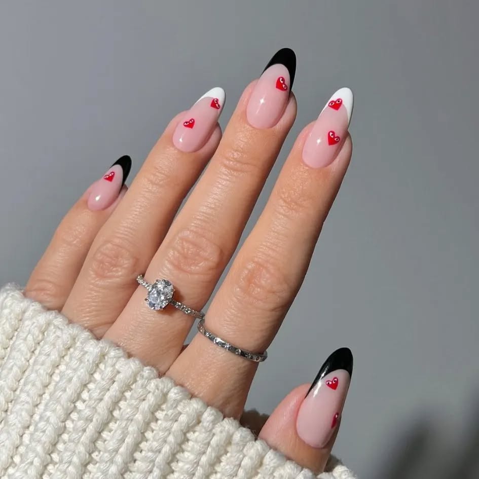 Neutral nails with deliberate heart accents