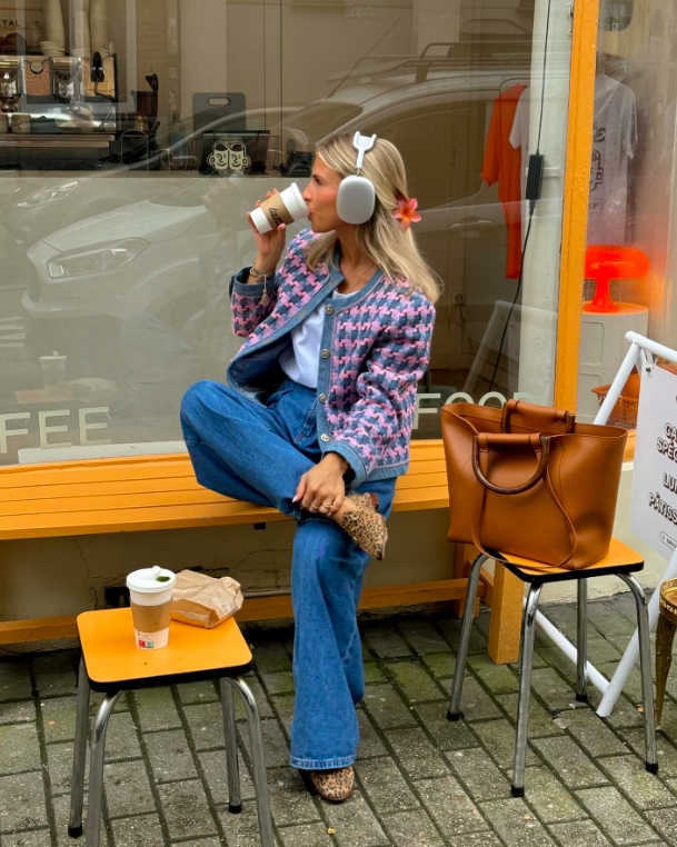 A textured jacket over denim with an oversized tote.