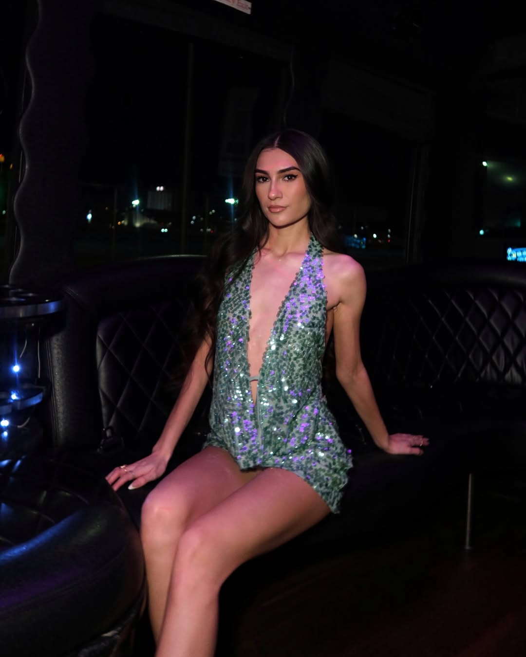 A plunging green sequin mini dress.