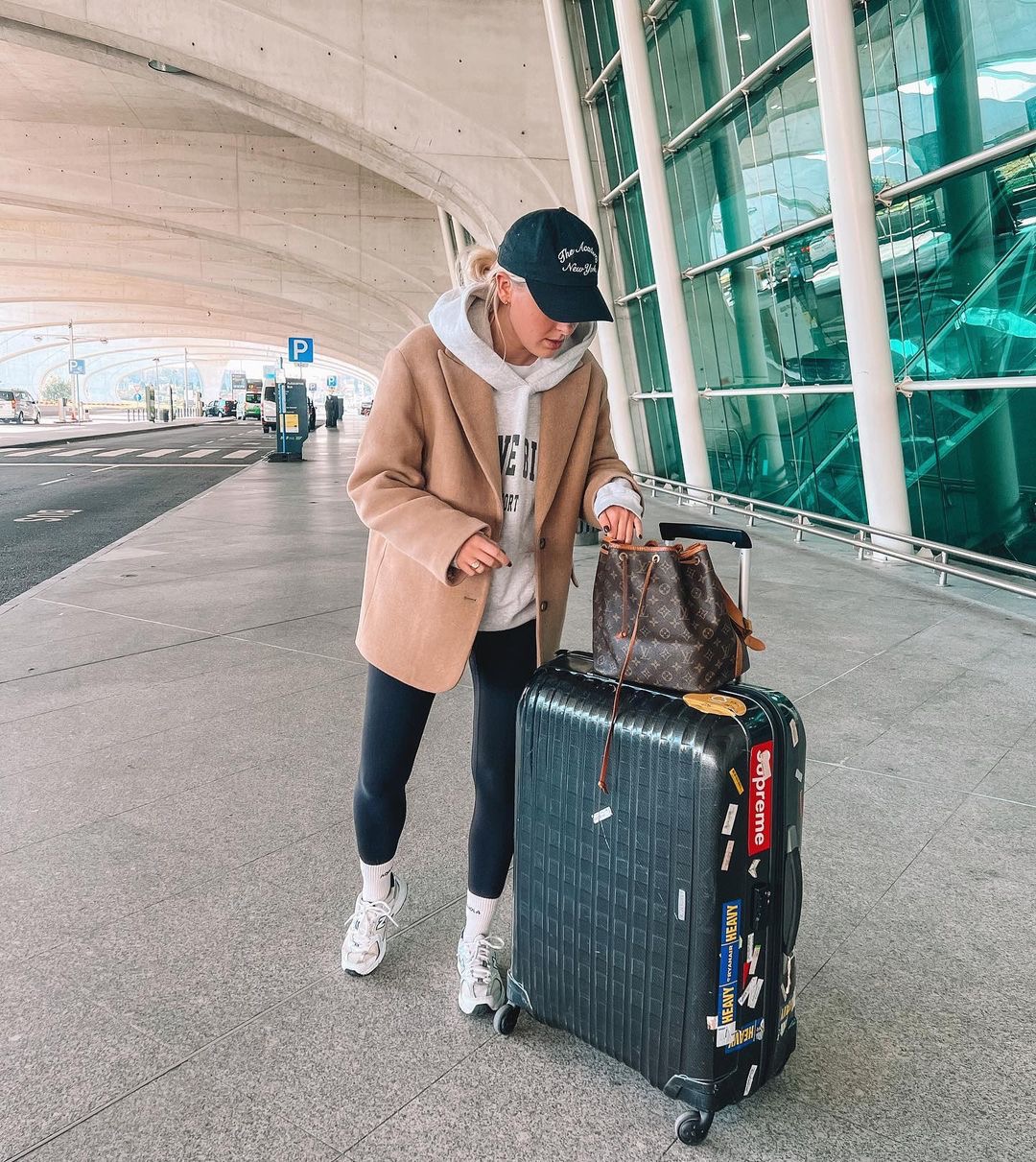 Effortless airport cool outfit with an oversized blazer and hoodie.