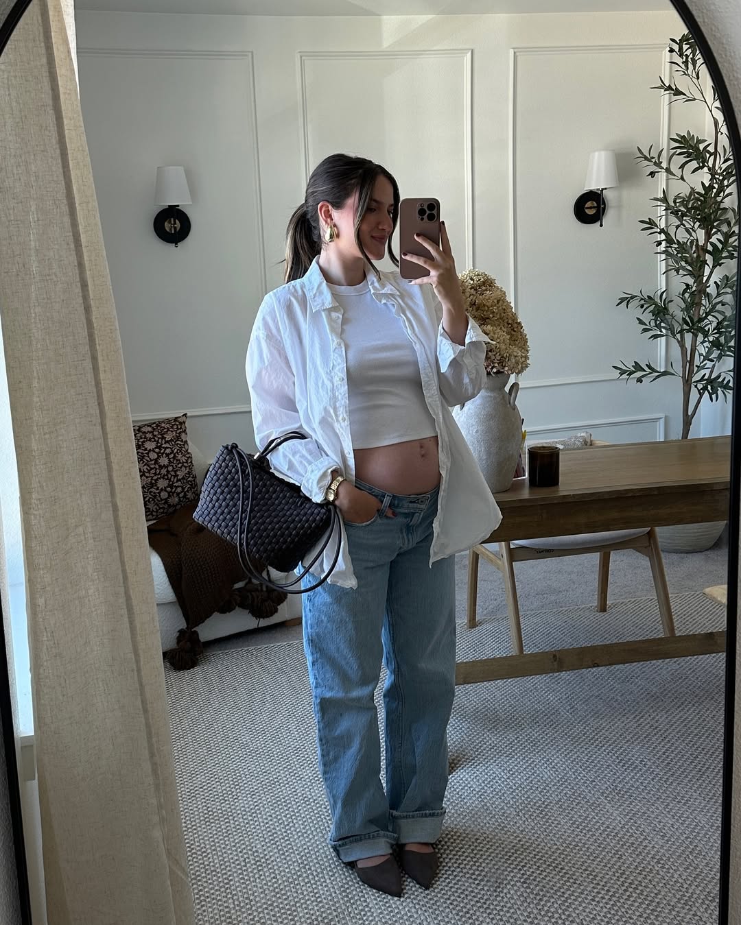 A stylish outfit in neutral tones that highlights the silhouette.