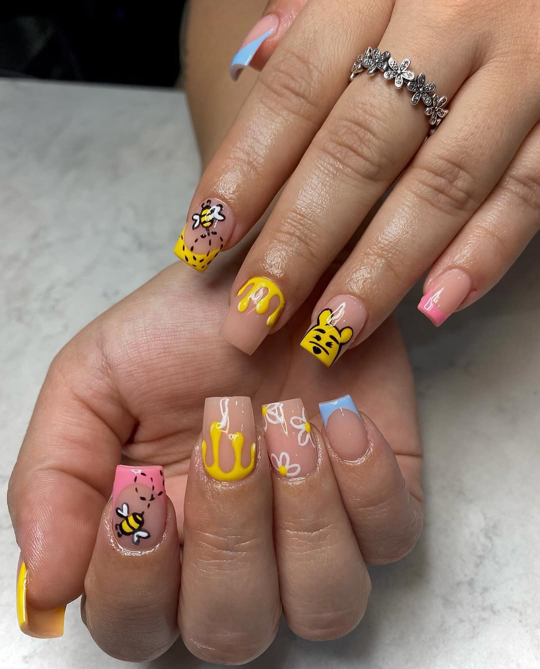 Honey drip yellow and blue nails with bees and Winnie-the-Pooh inspired art