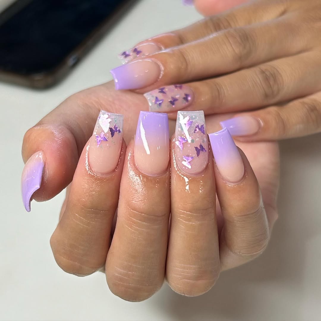 Lavender and sheer nude nails with butterfly confetti and sparkle