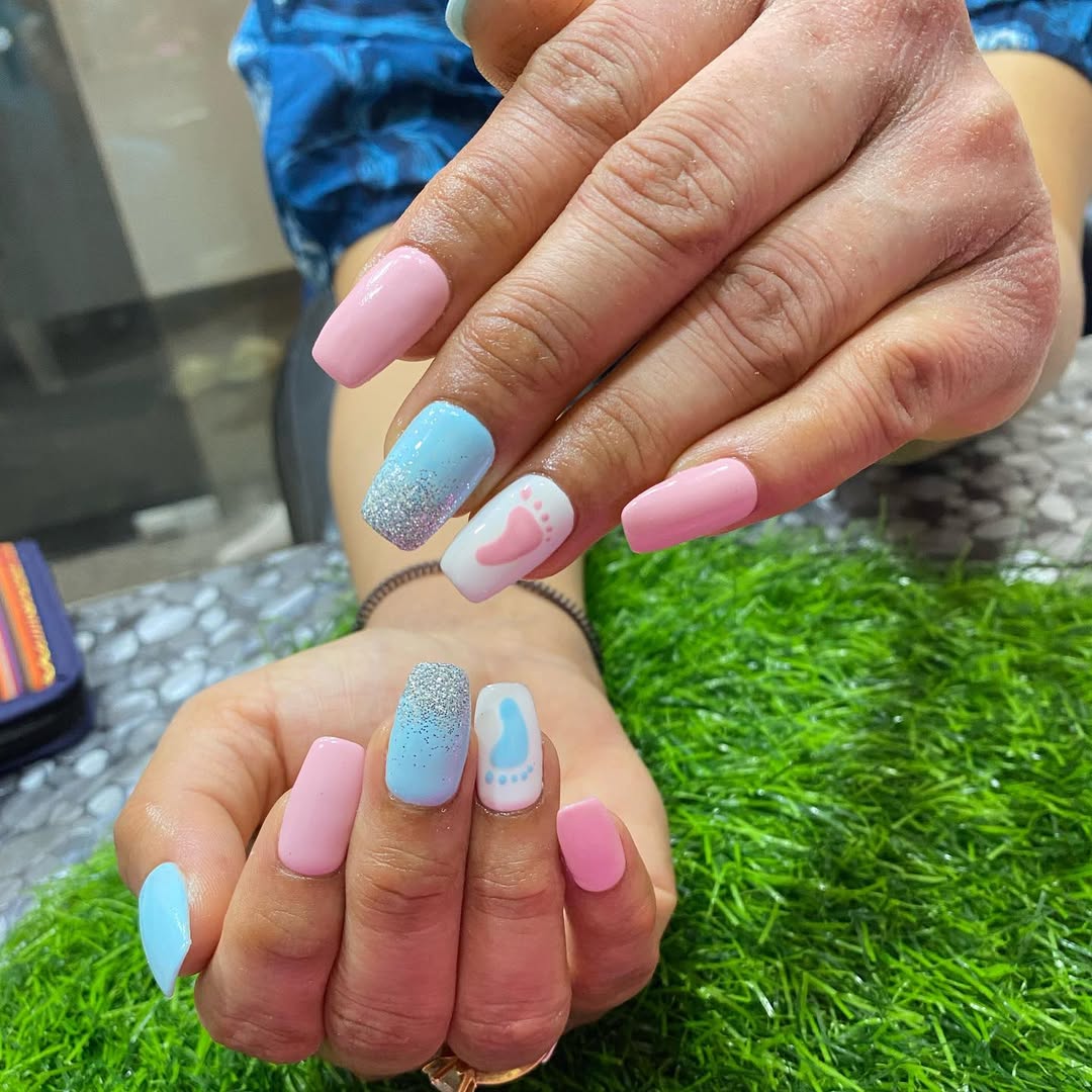 Pastel pink and blue nails with micro-glitter and footprints