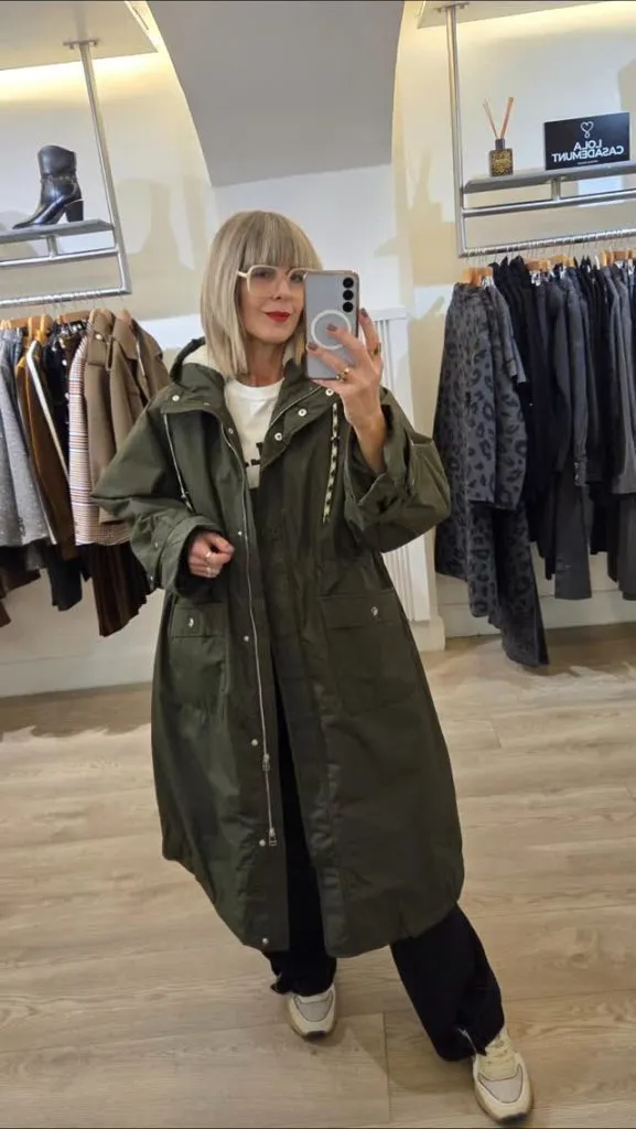 A hooded coat featuring a subtle pattern, maintaining a polished appearance.