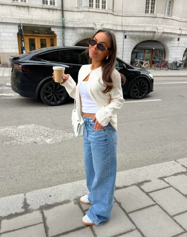 A pink top paired with tailored shorts.