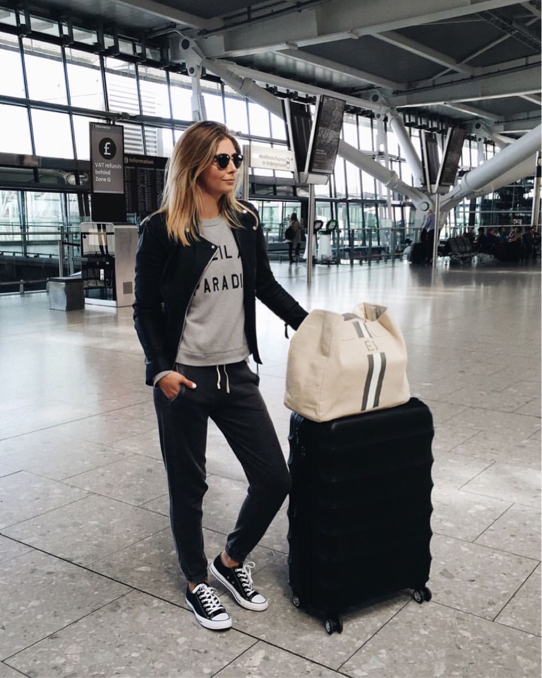 Sporty yet stylish airport outfit with clean lines.