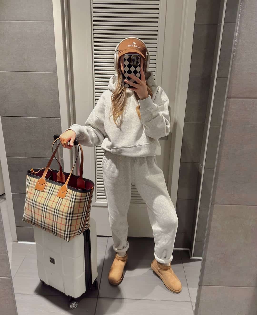 Sporty airport outfit with a stylish twist and comfortable elements.