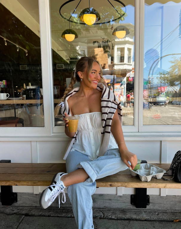 Soft tones and gentle movement in a floral-inspired look.