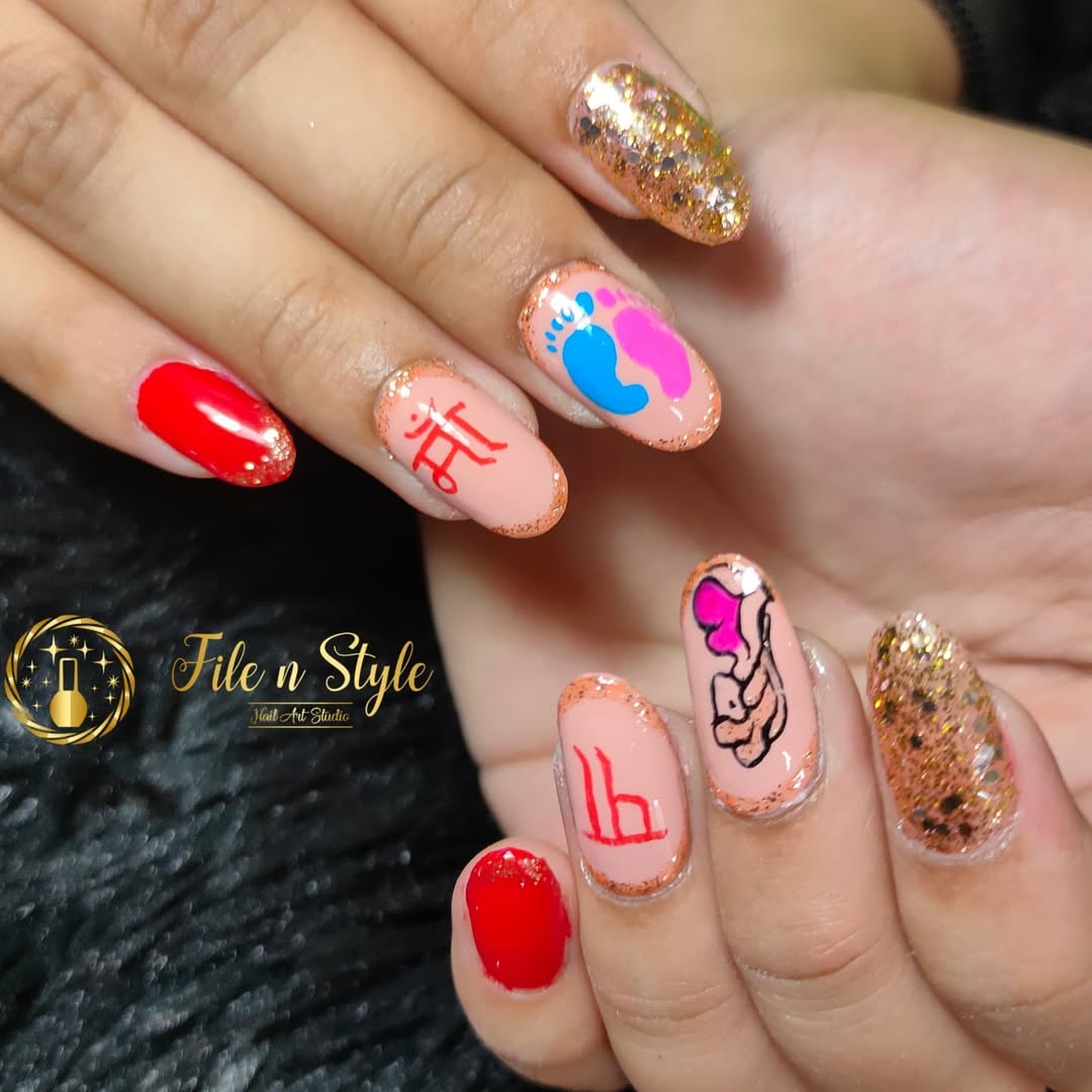 Gold glitter nails with pink and blue footprints