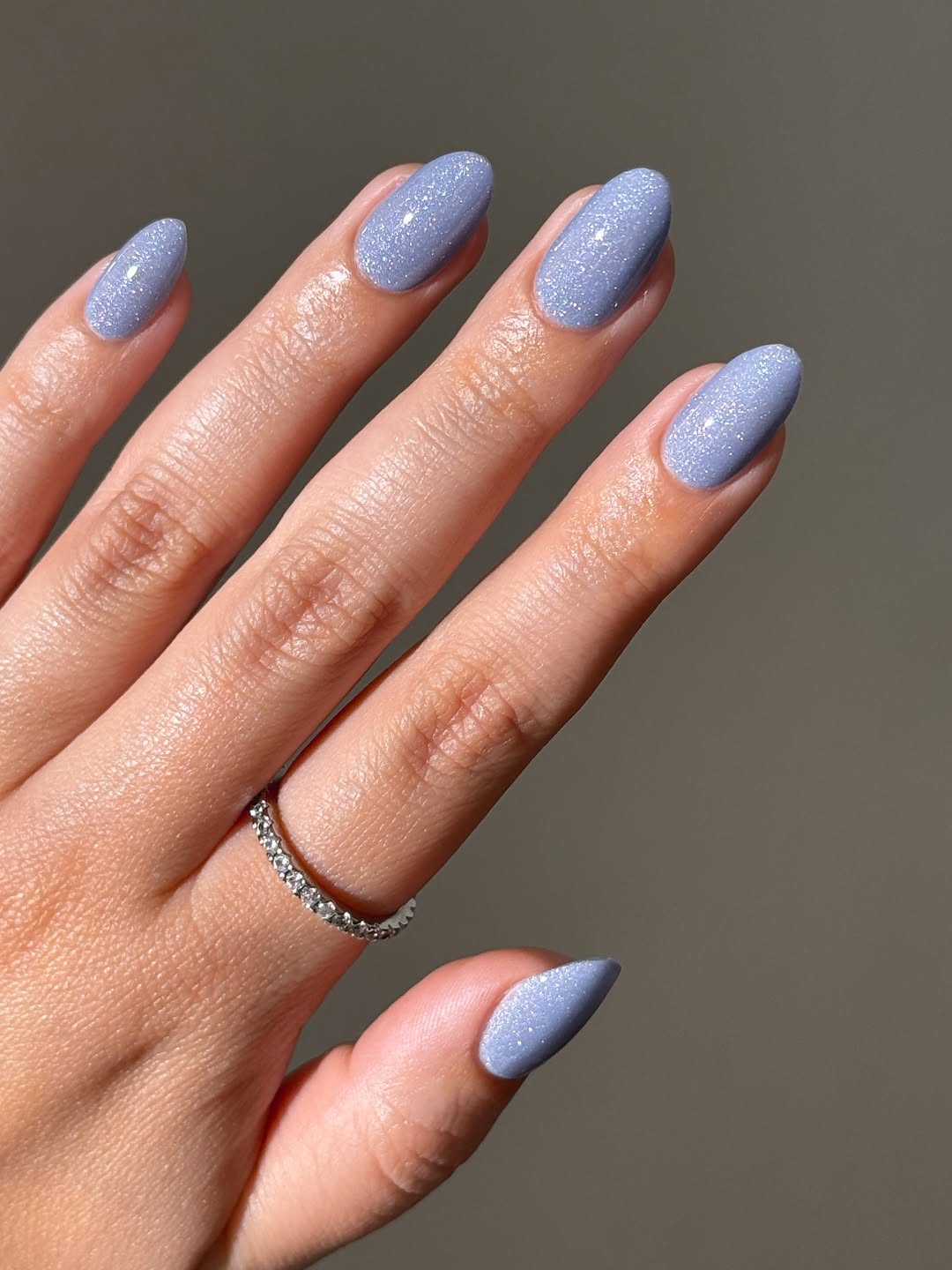 Soft icy blue polish with a fine shimmer for a winter glow.