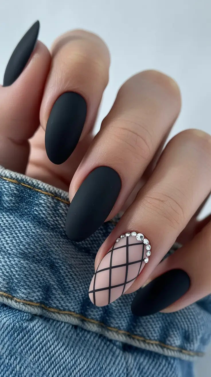 Matte black nails with gridded accent and crystal halo