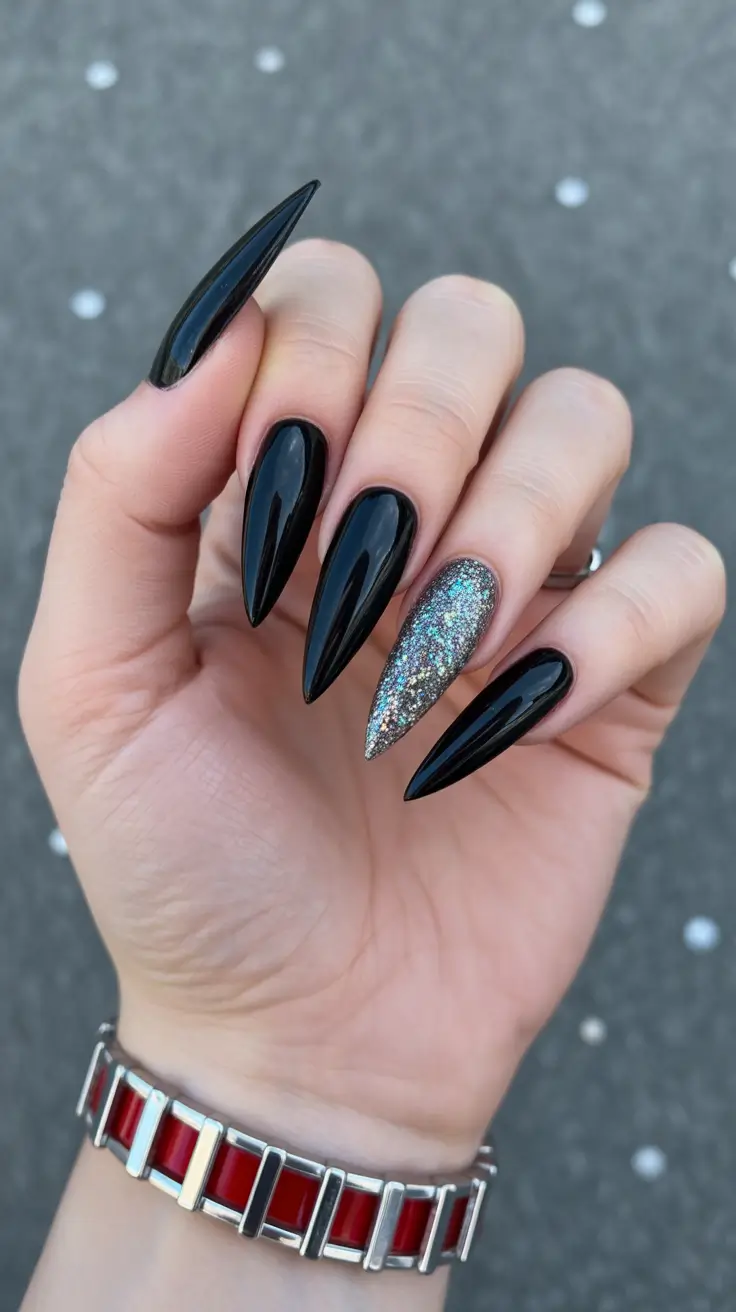 Ultra-long stiletto black nails with glitter accent