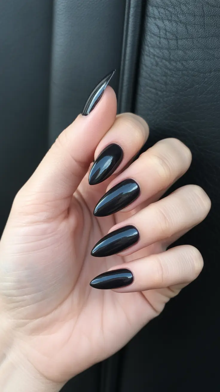 Sleek black almond nails