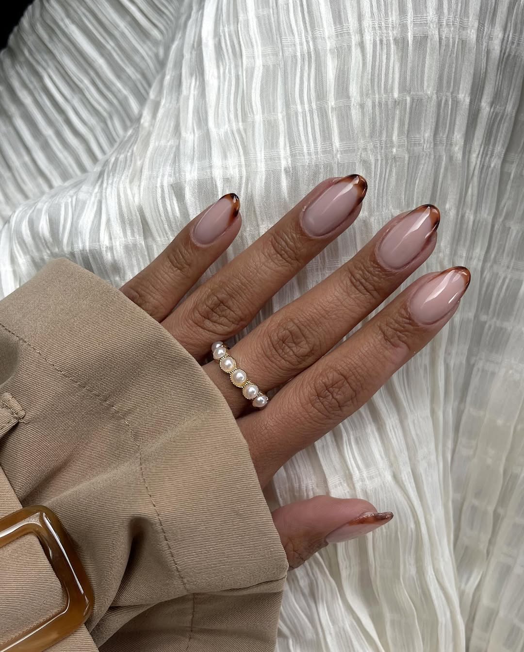 Nude nails with tortoise shell French tips