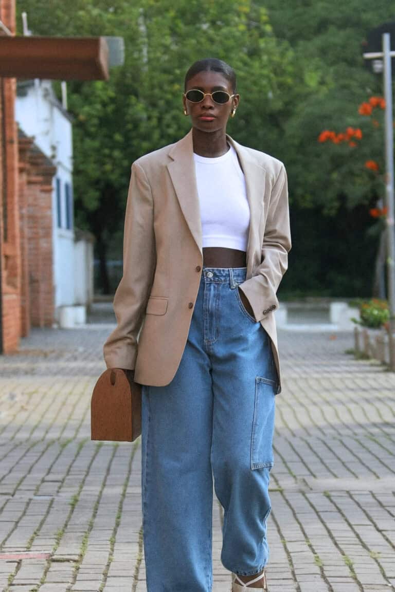 Woman wearing an oversized jacket with baggy jeans